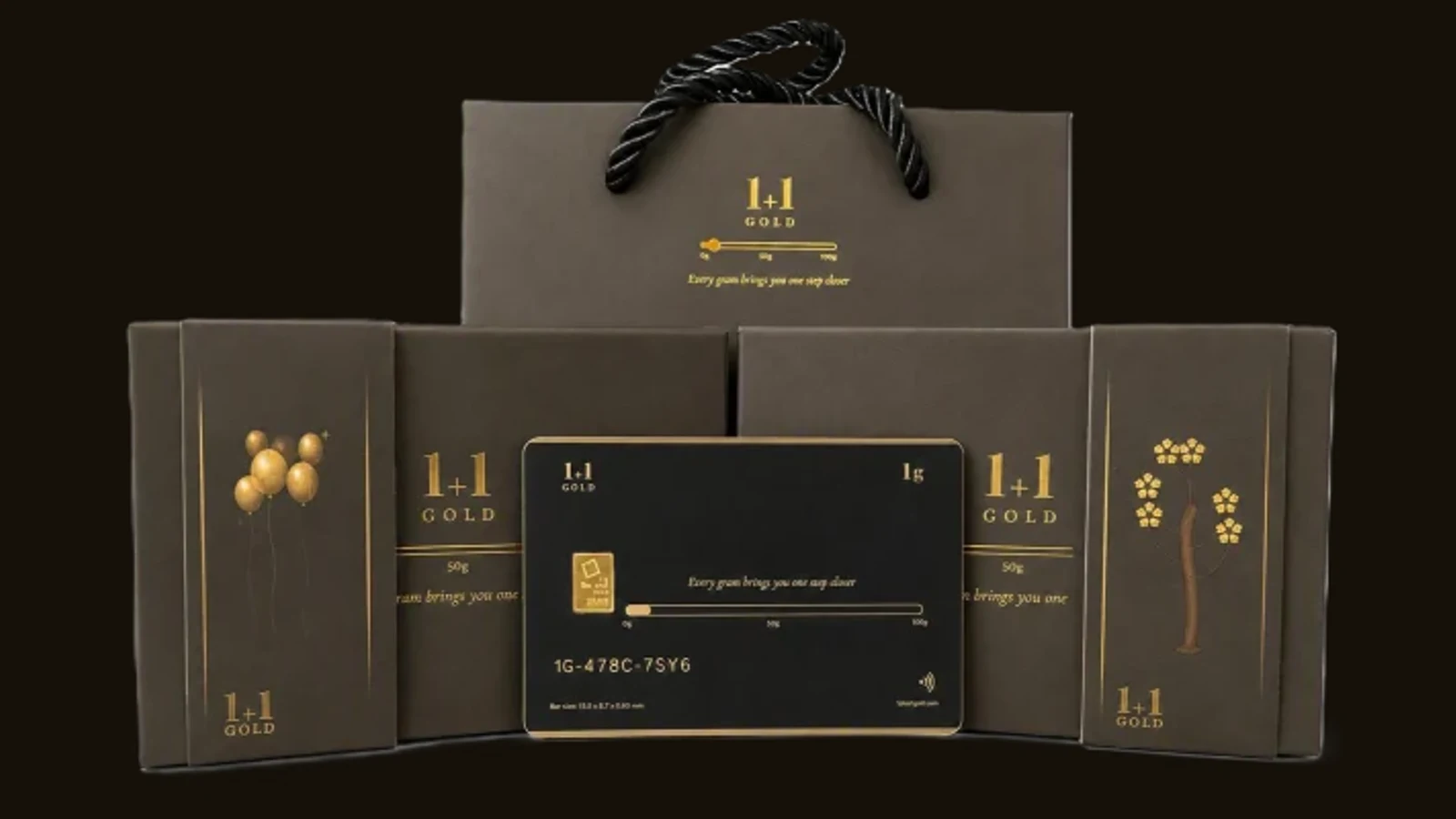 Five matte black 1Plus1Gold packaging cards fanned in a spread against a white background. The front card shows a 1g 999.9 fine gold bar seated in its window, the tagline 'Every gram brings you one step closer', a gold progress bar running from 0g to 100g, a laser-engraved serial number 1G-U6P8-Z25U